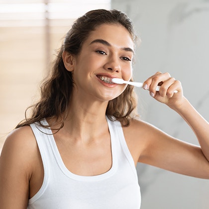Woman brushing teeth
