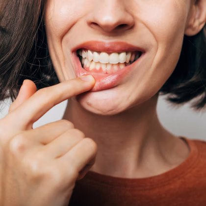 Woman looking at her gums